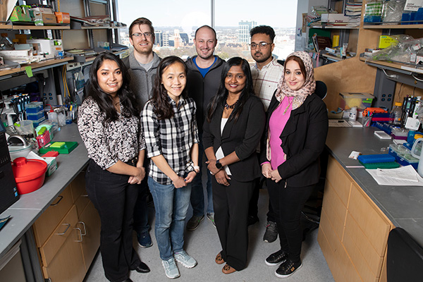 Members of the Division of Clinical Pharmacology pose in their lab.