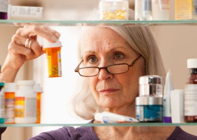 woman with pill bottles