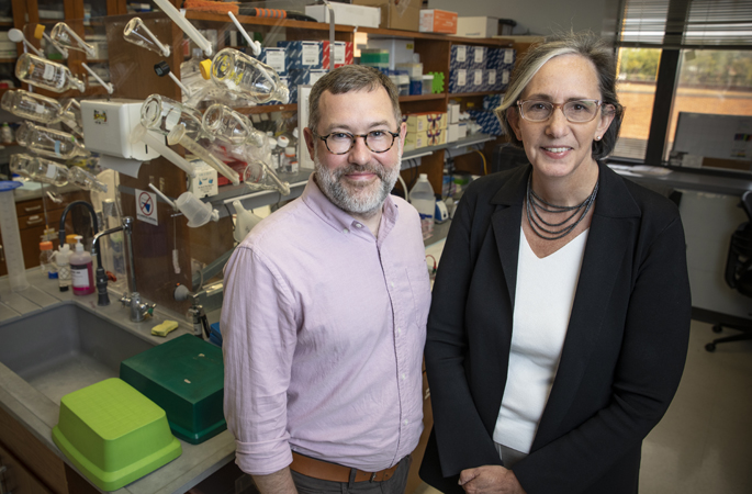 Frank Mason, PhD, left, Kimryn Rathmell, MD, PhD, and their colleagues have identified an early event in the development of cancer, one that could lead to new ways to prevent it. (photo by Erin O. Smith)