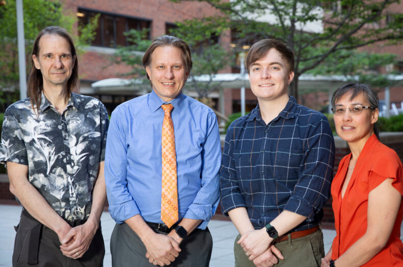 Mosley research group, three men, one woman