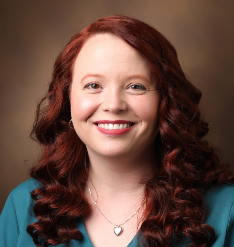 Dr. Jennifer Gaddy, a young white woman with curly red hair.