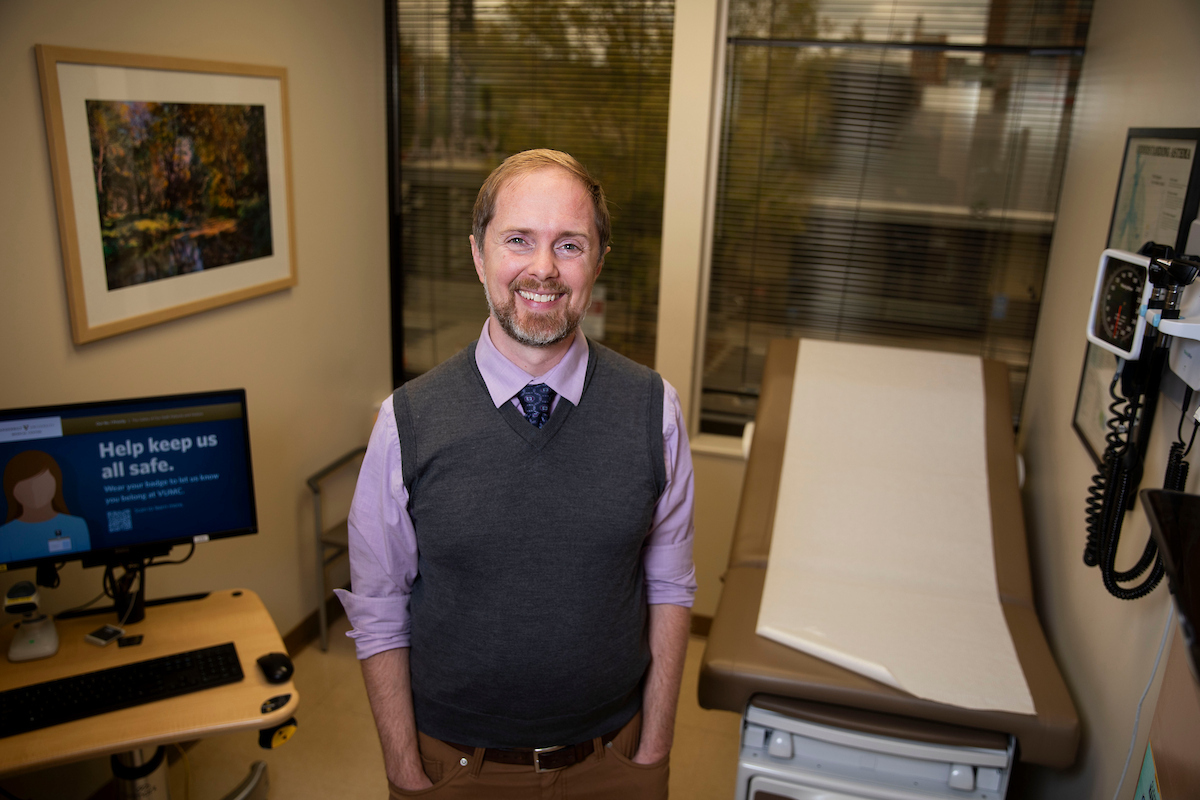Dr. Cosby Stone poses in an empty exam room at the drug allergy clinic.