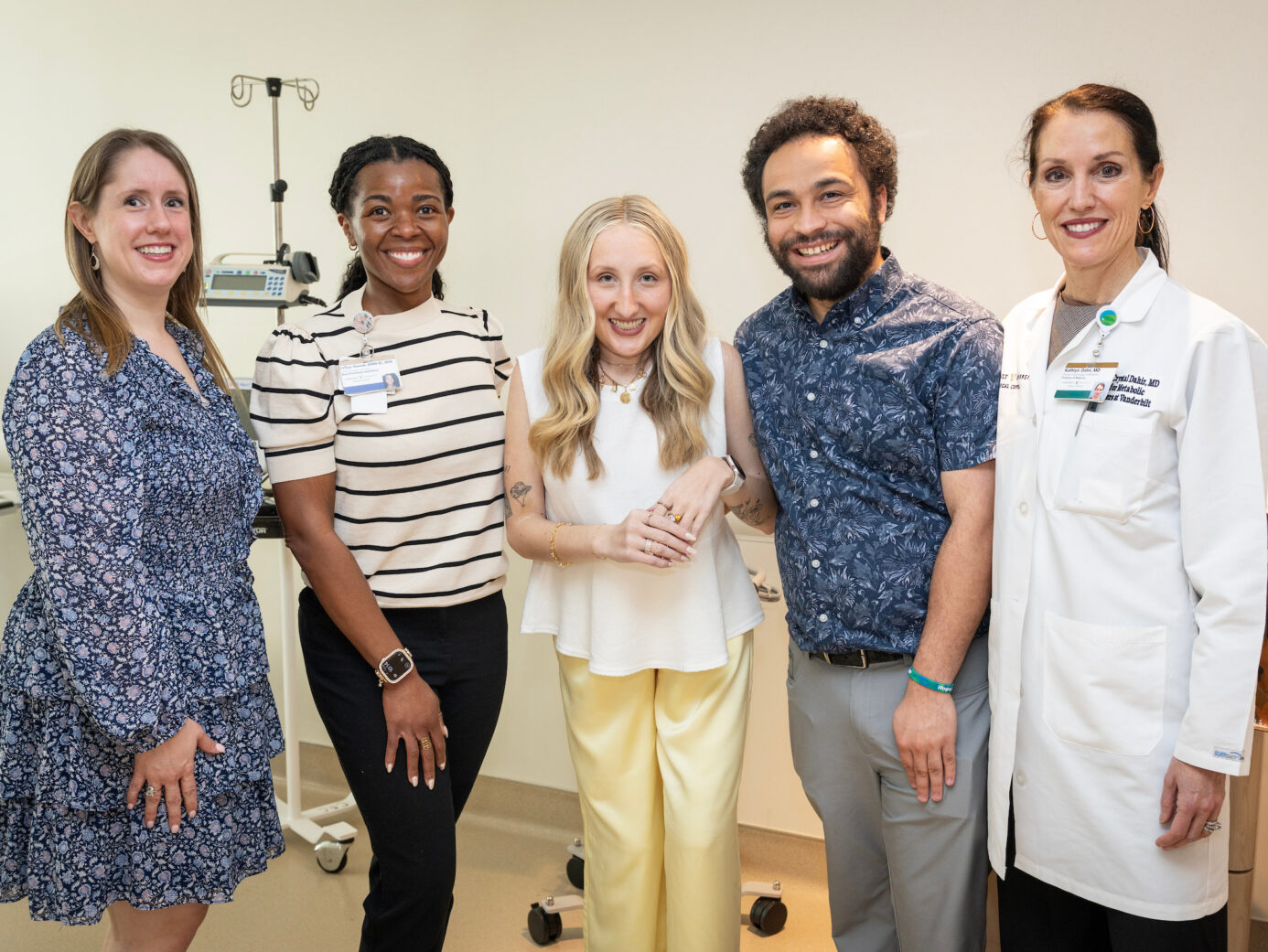 Jordyn Bugarin and her boyfriend, Jordan Thomas, together with her care team members Emily Shardelow, left, LaToya Hannah, and Dr. Kathryn Dahir, right, during her final visit for the OPTIMA trial.