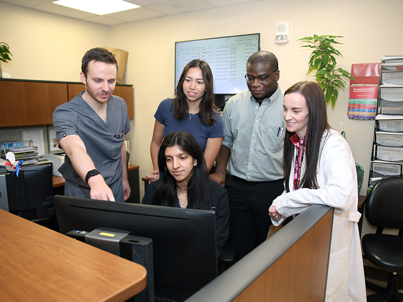 Group researching using a computer