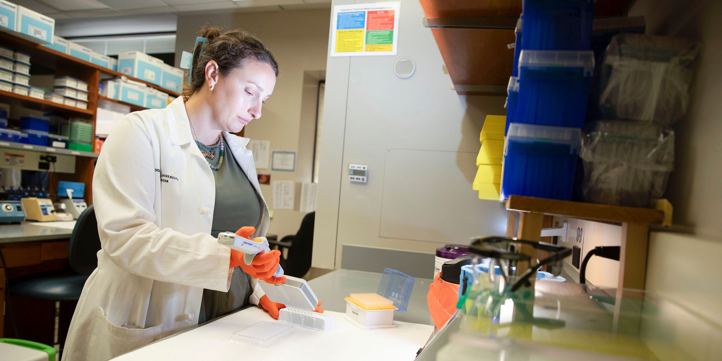 A female researcher works in the cardiology core lab.