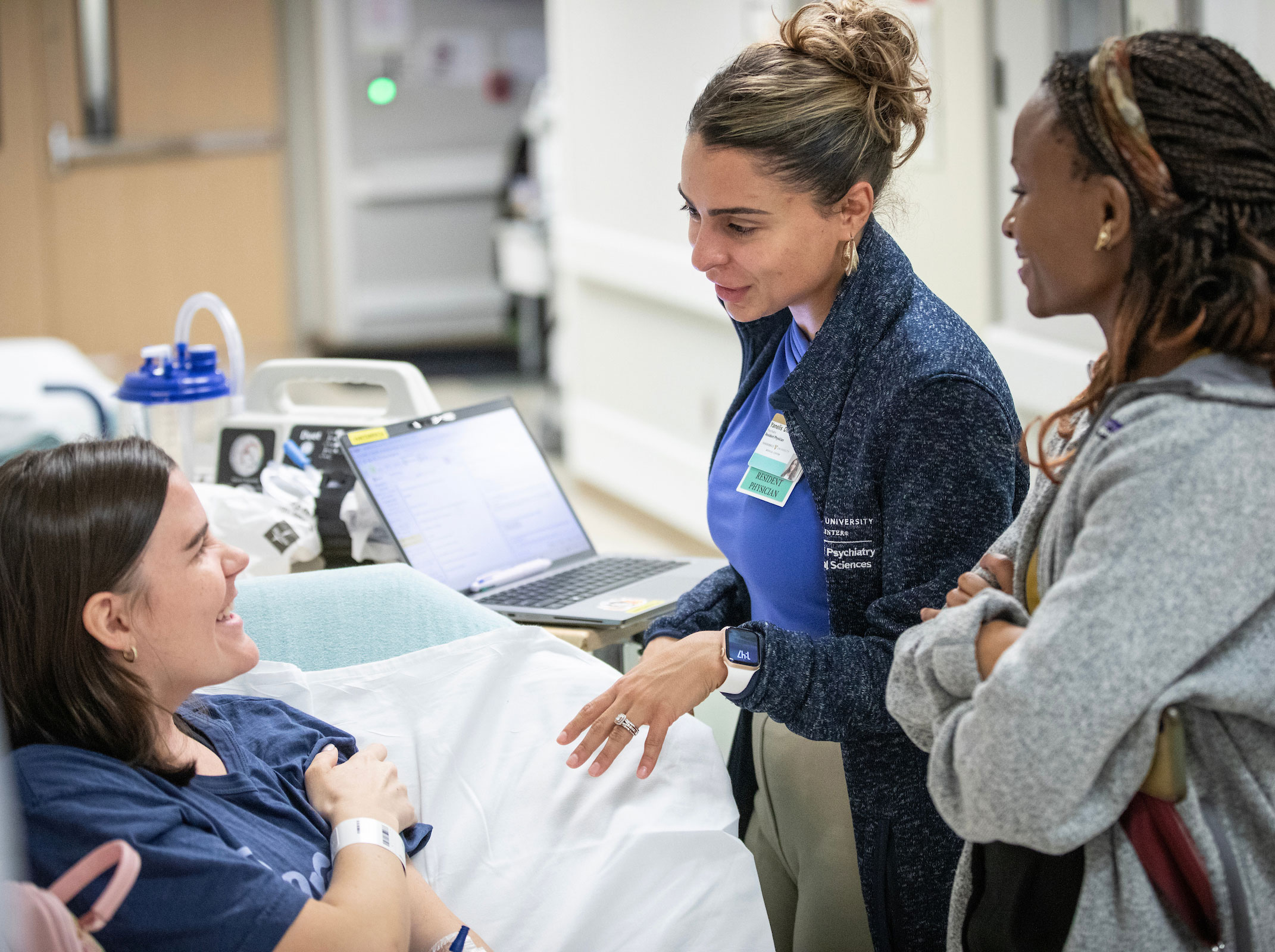 Medical student Sylvie Muhimpundu, at right, observes a doctor-patient interaction in the Vanderbilt emergency department.