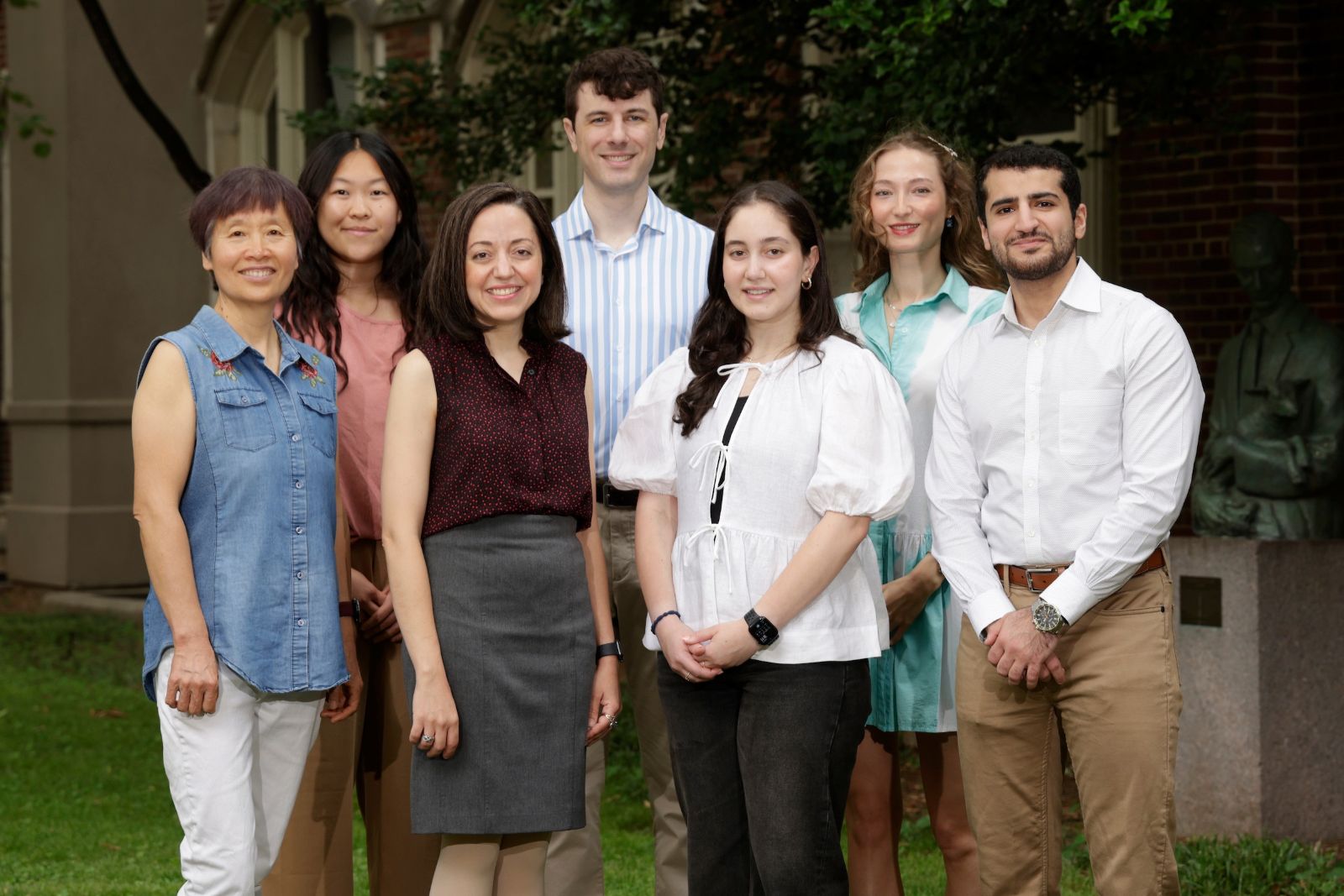 Dr. Mona Mashayekhi and six lab members pose outside on the VUMC campus.